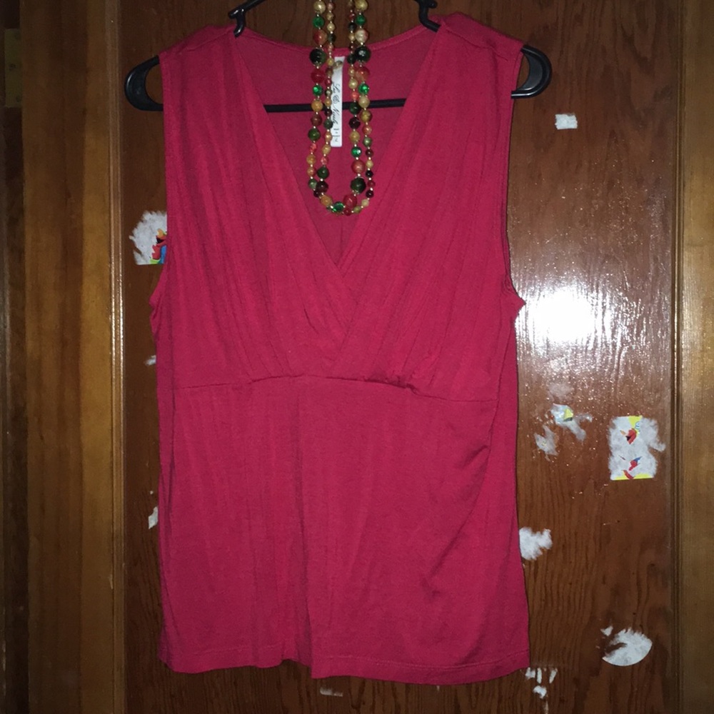 Red sleeveless v neck shirt